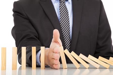 Businessman Hand Stop Dominoes Continuous Toppled ID:57705140